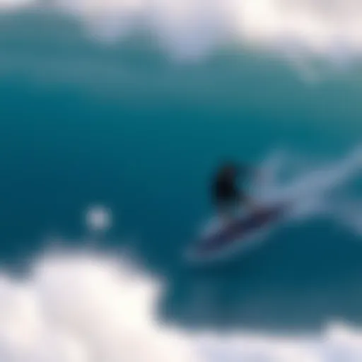 Skimboarder catching a wave