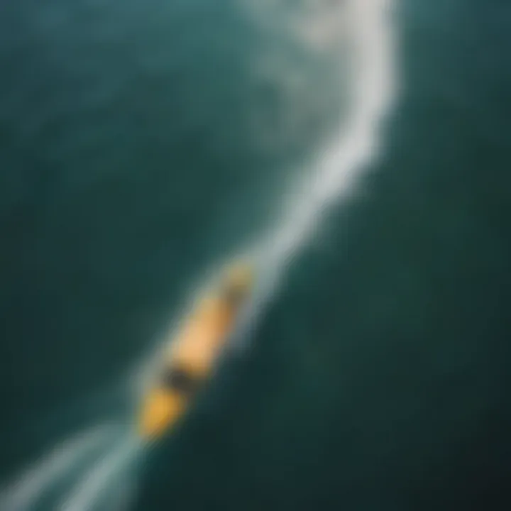 An aerial view showing paddle boarders gliding over crystal-clear waters.