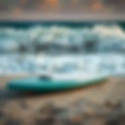 A stunning BZ bodyboard resting on the sand beside vibrant ocean waves