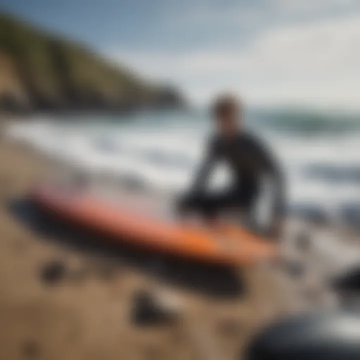 Surfboard and wetsuit laid out on a rocky beach