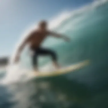 Surfer demonstrating the use of ally floating swim fins in action on a wave.