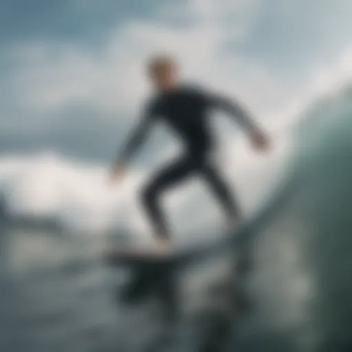 A surfer paddling through waves in a sleek wetsuit