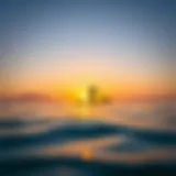 A serene sunrise over a calm ocean with a paddle boarder gliding smoothly across the water.