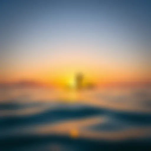 A serene sunrise over a calm ocean with a paddle boarder gliding smoothly across the water.