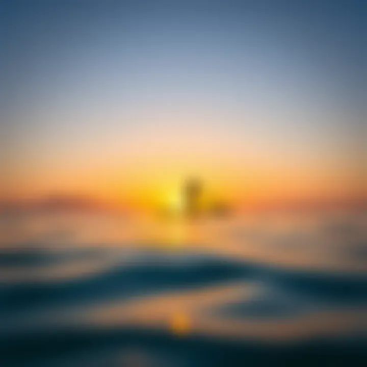 A serene sunrise over a calm ocean with a paddle boarder gliding smoothly across the water.