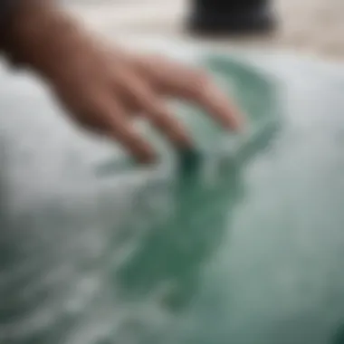 Close-up of resin being applied to a surfboard