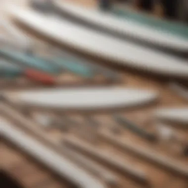 Array of surfboard shaping tools laid out neatly