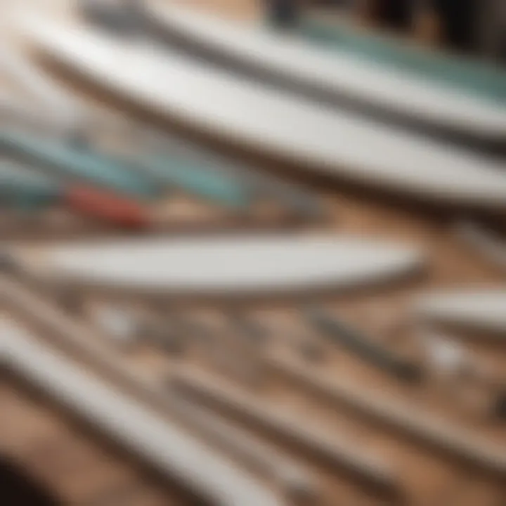 Array of surfboard shaping tools laid out neatly