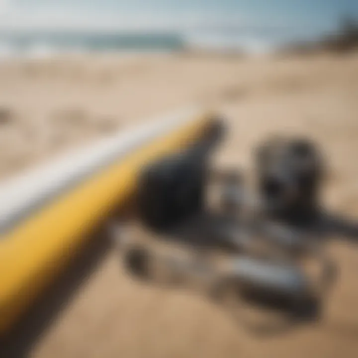 Close-up of surf gear and accessories on the sand