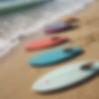 An array of skimboards displayed on a sandy beach