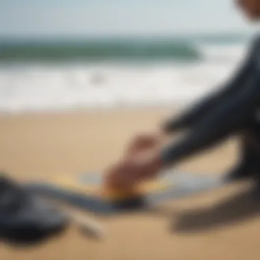 Preparing Surfing Gear with Wetsuit Tape Surfer readying gear with wetsuit tape by the beach