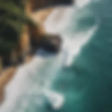 An aerial view of a hidden cove with surfers catching waves