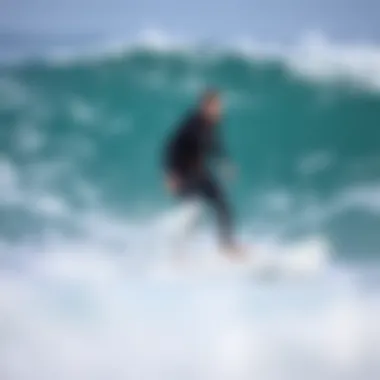 A Dakine harness in use by a surfer riding a wave.