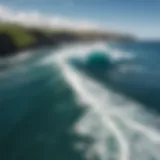 Stunning aerial view of Honolua Bay showcasing vibrant waves crashing against the shore