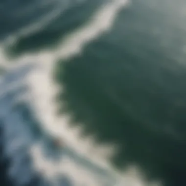 An aerial view of a serene lake, highlighting the perfect conditions for wake surfing.