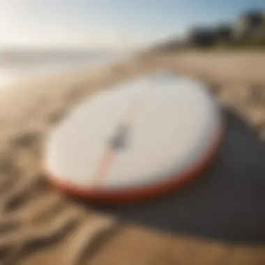 Surfboard resting on the sand