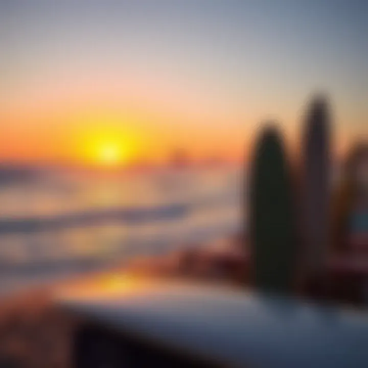 A breathtaking sunset view over the ocean with surfboards on the sand