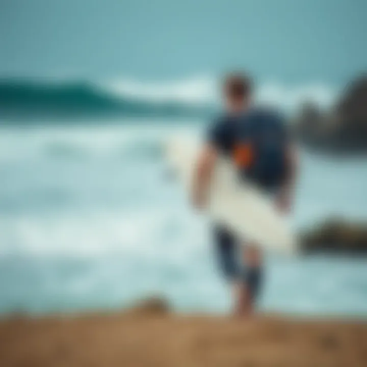 A surfer carrying the Cor Surf backpack while walking towards the waves
