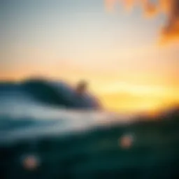Surfer riding a wave at sunset