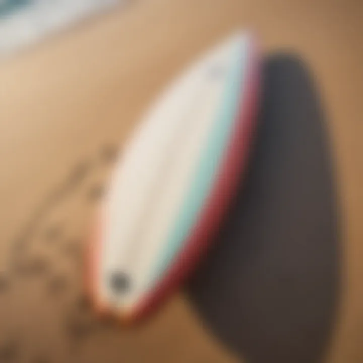 Surfboard resting on the sandy beach