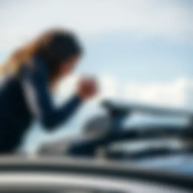 User inspecting safety features of the Thule roof rack