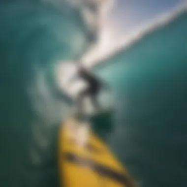 A surfer capturing a wave with a GoPro camera.