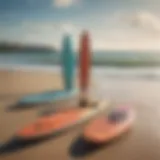 A diverse range of paddle boards displayed on a sandy beach