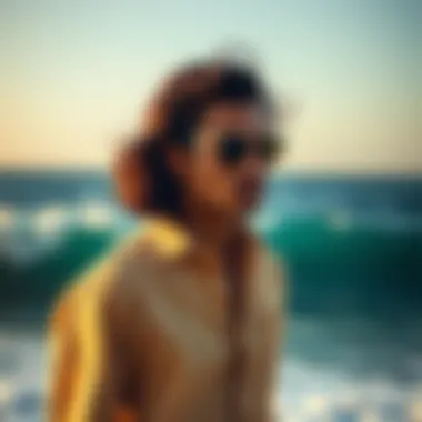 A stylish model showcasing the Izod Surfcaster shirt against a backdrop of ocean waves.