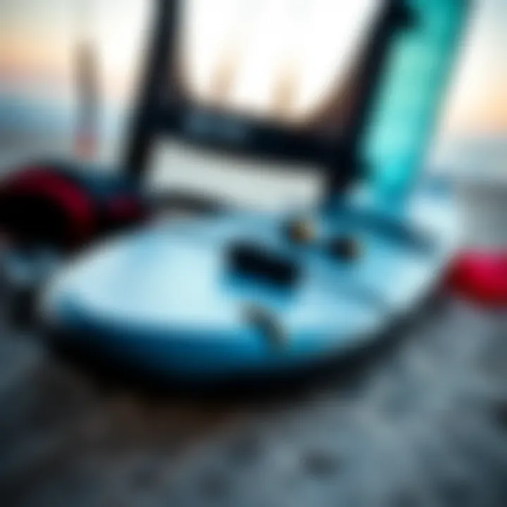 Close-up of essential kite surfing gear laid out on the beach