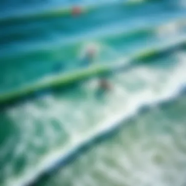 An aerial view of kitesurfers gliding over the waves at a popular Californian beach