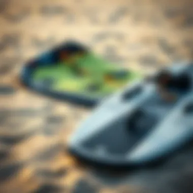 Close-up of essential kitesurfing gear including a kite and board laid out on the sand