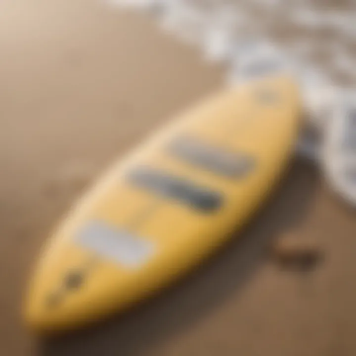 Surfboard resting on the beach with Manda Organic SPF 50 Sun Paste in the foreground