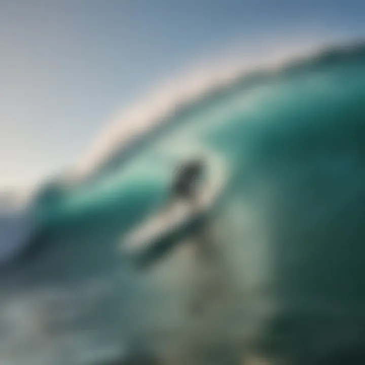 A surfer riding a wave on an ideal-sized surfboard.