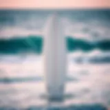 Sleek Surfboard and Ocean A sleek surfboard displayed against a vibrant ocean background