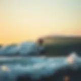 A surfer skillfully catching a wave at sunrise