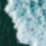 Aerial view of ocean waves crashing onto the shore