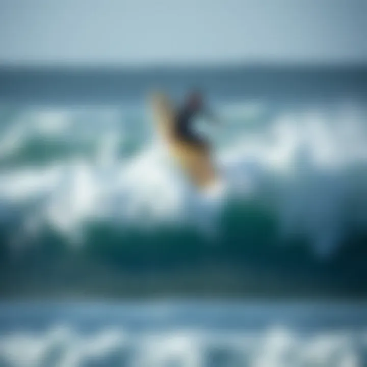 Odysea Surfboard in Action on the Waves Odysea surfboard in action on waves with surfer riding it