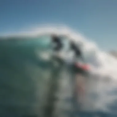 Surf instructor guiding a student on the waves