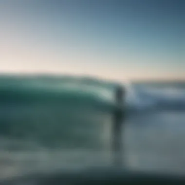 A surfer observing ocean patterns for optimal wave conditions.