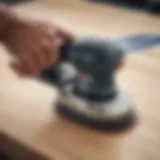 Close-up of SurfPrep orbital sander showcasing its ergonomic design