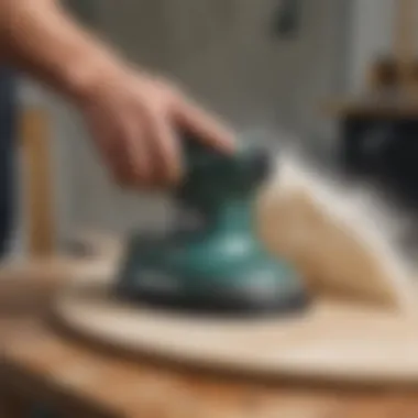 User utilizing the SurfPrep orbital sander in a surfboard workshop