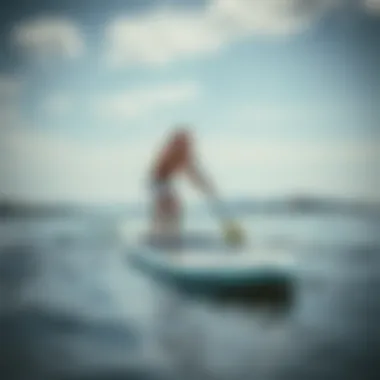 Testing Paddleboard Fit Person testing paddleboard in water for optimal fit