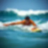 Surfer demonstrating powerful swimming technique