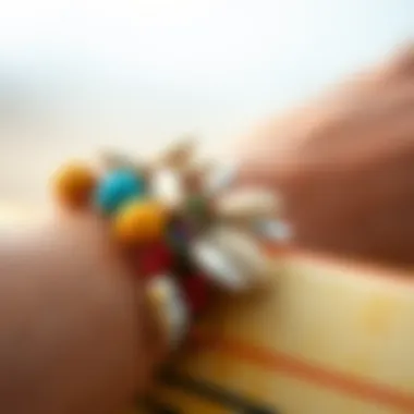 A close-up of a colorful surfer bracelet adorned with shells and beads
