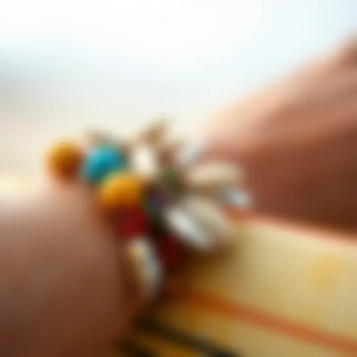 A close-up of a colorful surfer bracelet adorned with shells and beads
