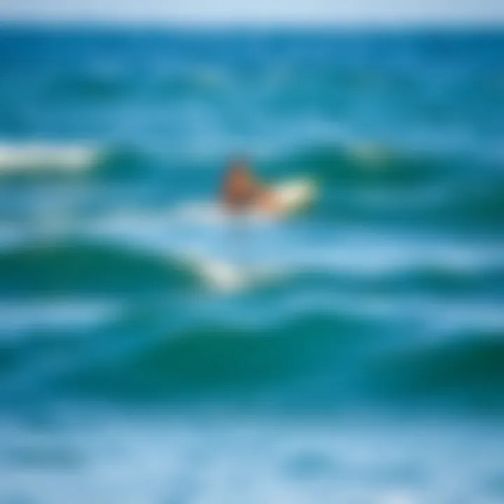 Beginner paddle boarder navigating through gentle waves