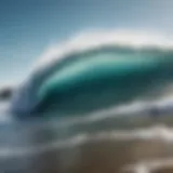 A stunning view of waves crashing against the shore under a clear blue sky