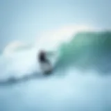 A surfer executing a drop-in maneuver on a wave