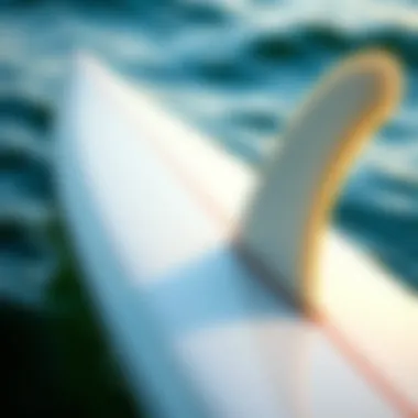 Close-up of a single fin surfboard showcasing its unique design