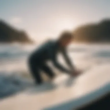 A surfer examining the condition of a second-hand surfboard